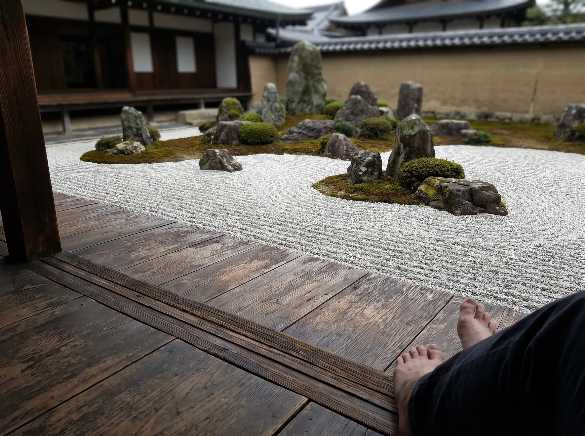 A zen rock garden viewed from a wooden veranda